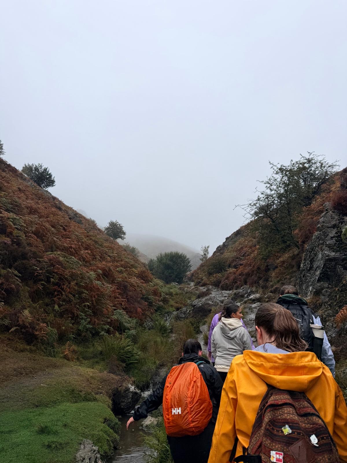 The group making their way through the hills